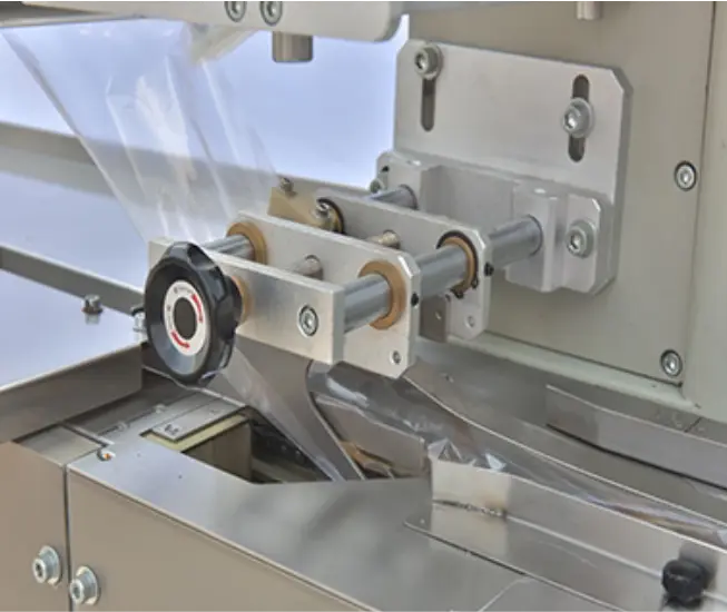 Bag making device of  flow wrap machine for biscuits